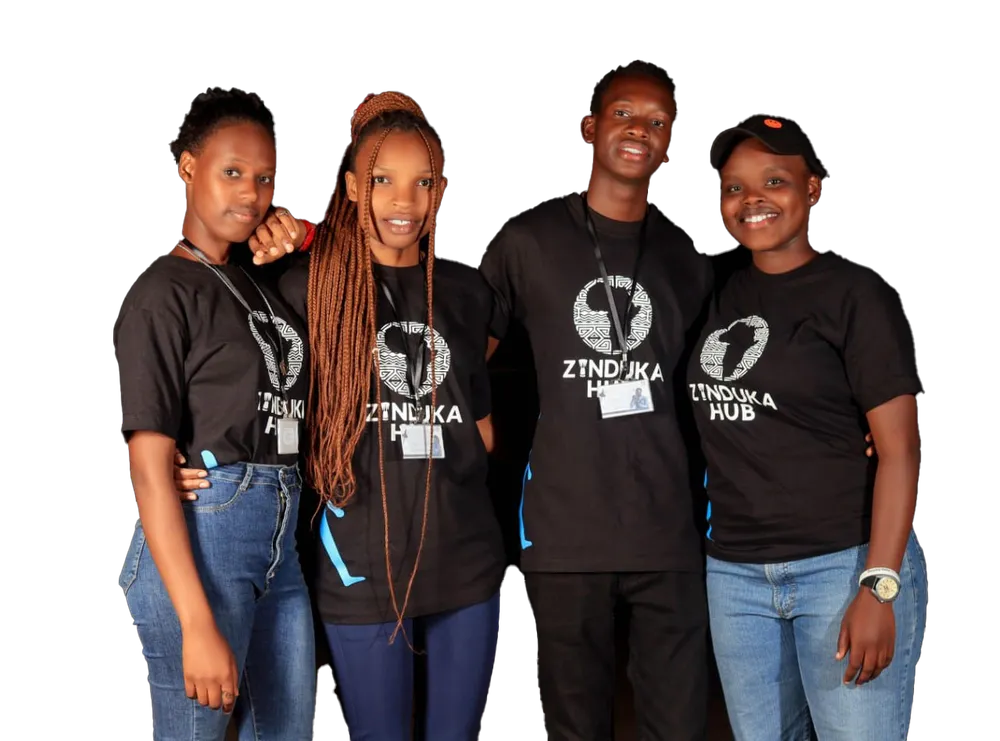 Four Zinduka Hub members wearing their community T-shirts